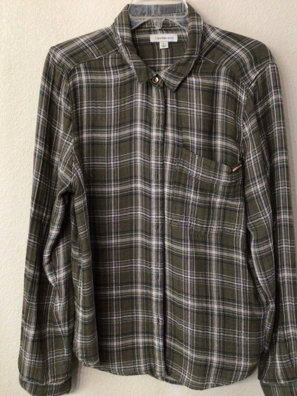 Calvin Klein jeans, button-down long sleeve shirt. Size large. Great shape.